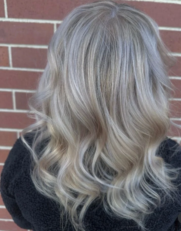 Cool dimensional silver blonde hair by Stephanie Thomas at Gypsy Cosmo Salon